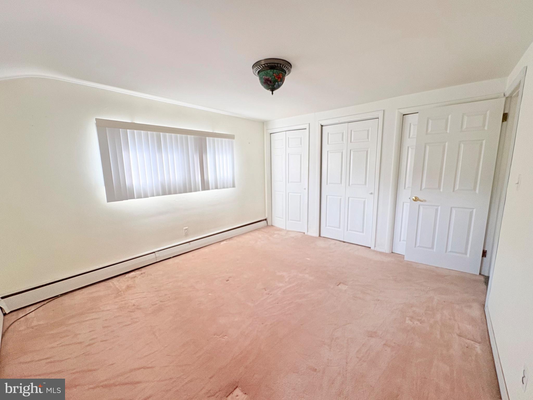 155 Locust Avenue Hamilton, NJ 08610 - Photo 15 of 25 an empty room with windows and closet