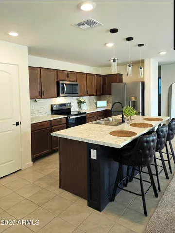 a kitchen with a sink cabinets and window