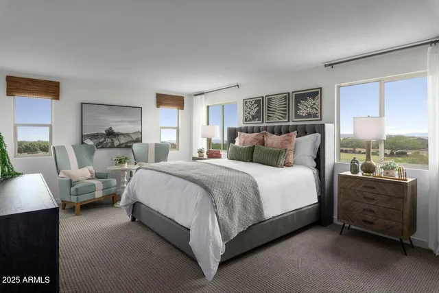 a bedroom with bed and window