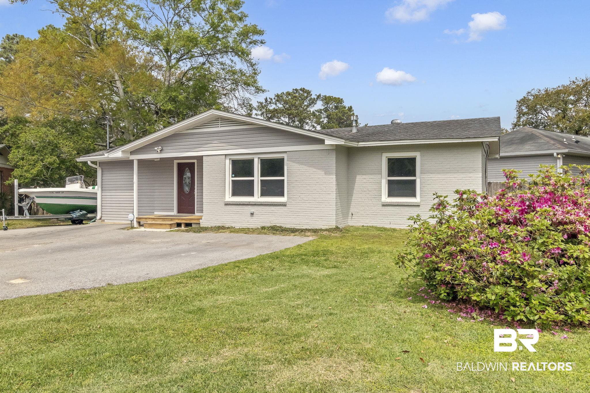 2901 Alston Court Mobile, AL 36605 - Photo 2 of 59 Single story home with a front lawn and brick siding