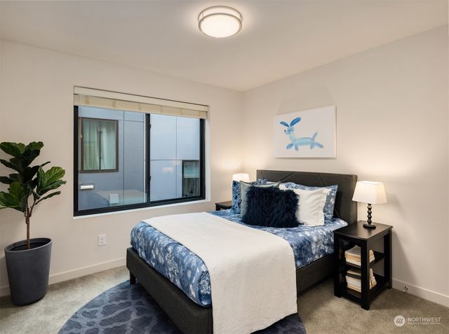 a bedroom with a bed and a couch