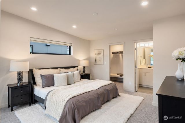 a bathroom with a shower and a sink