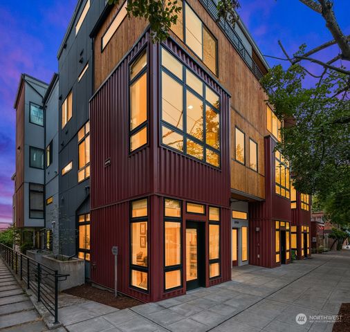 a front view of a building with glass windows and door