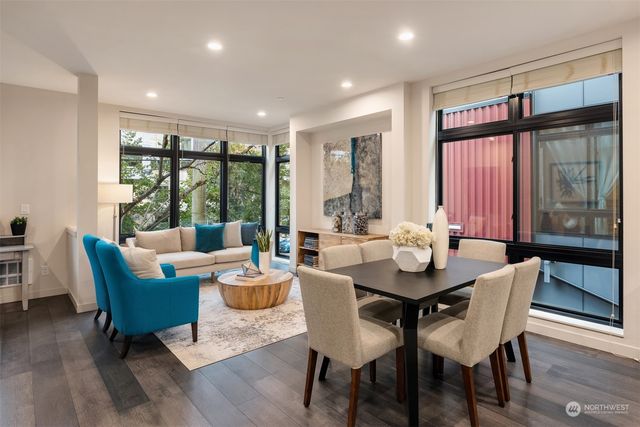 a living room with furniture kitchen view and a dining table