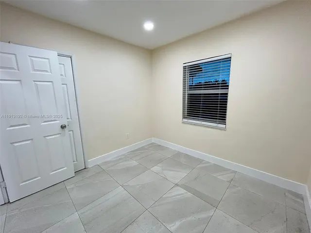 an empty room with a bathroom