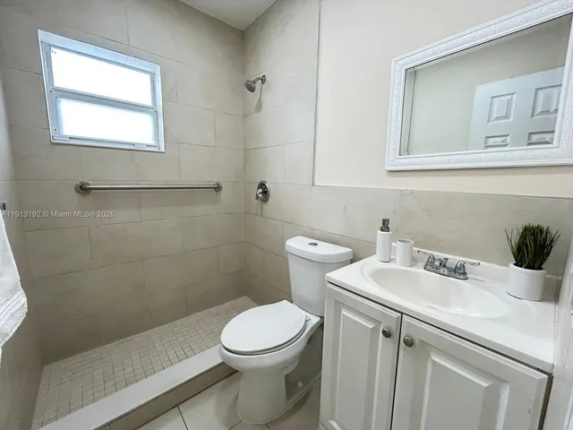 a view of a bathroom from a corridor
