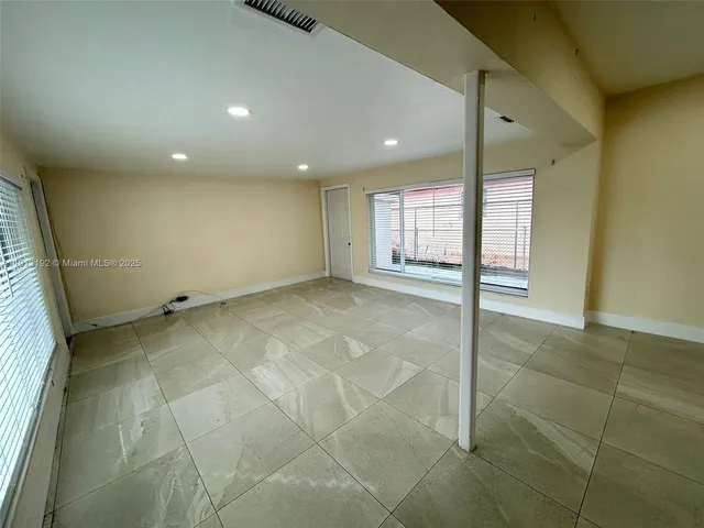 a kitchen with a sink stove top oven and microwave