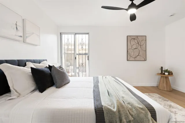 a bedroom with bed and window