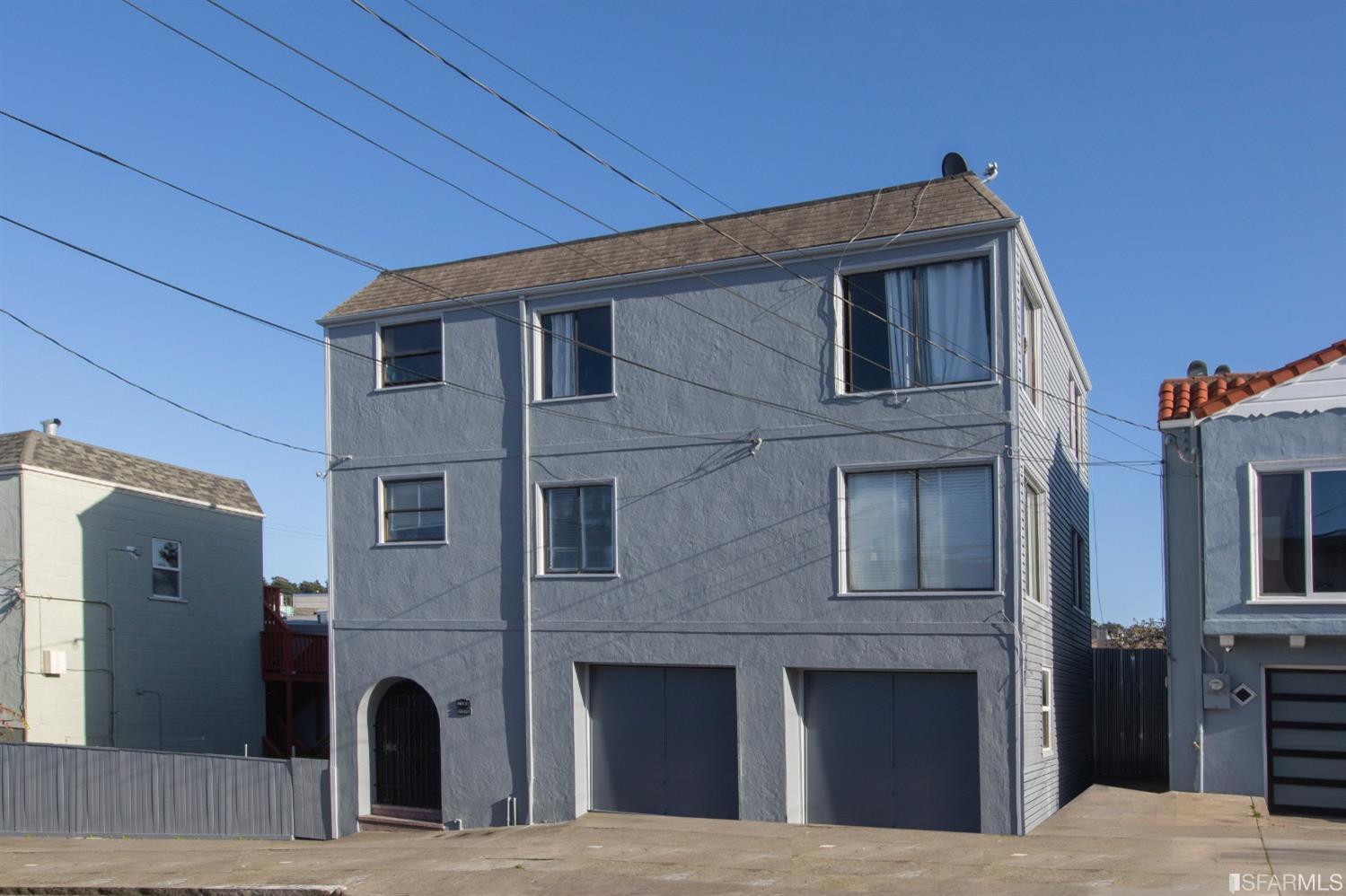 a front view of a house with glass windows