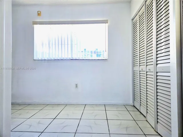 a view of a room that has a window in it