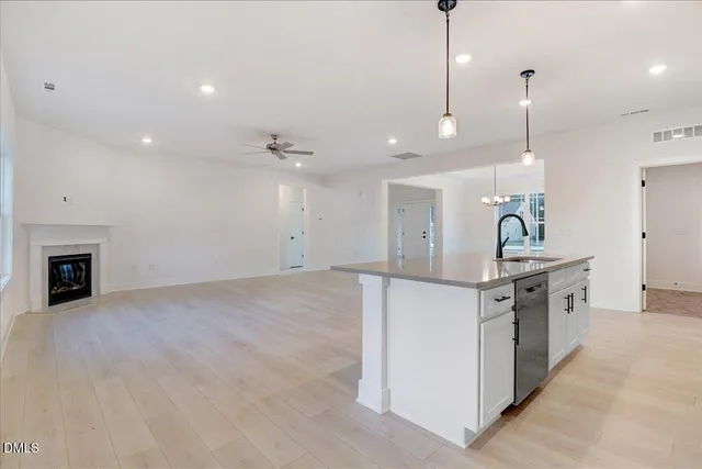 a kitchen with a sink and a refrigerator