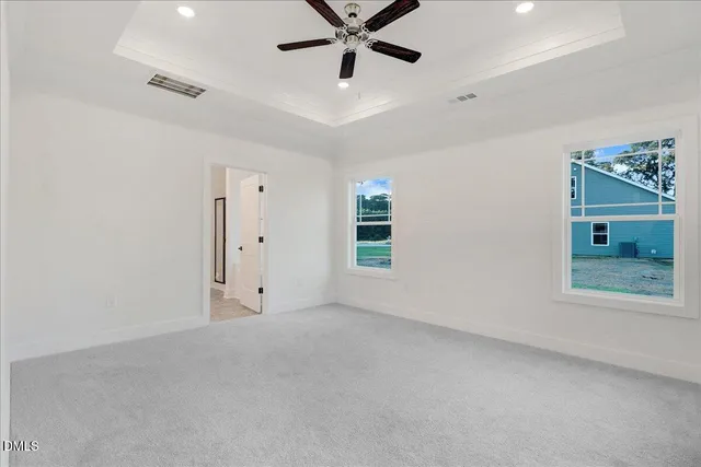 a bathroom with double vanity sinks and a mirror