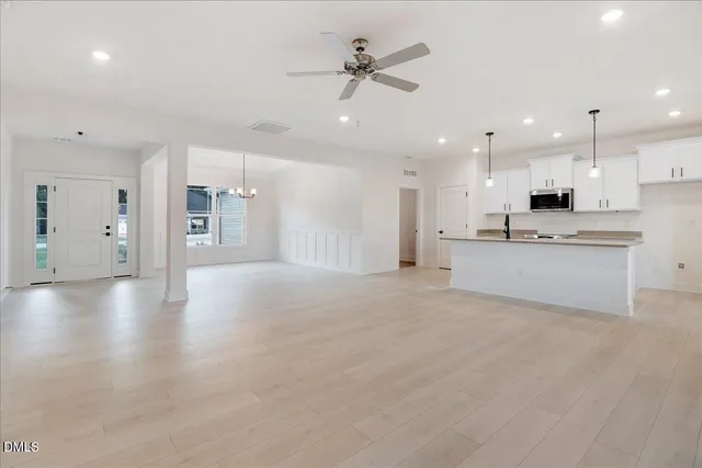 a kitchen with a sink stove and microwave