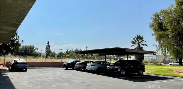 a view of a car parked in the yard