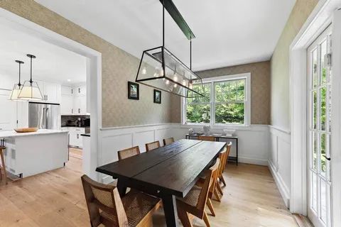 a view of a dining room with furniture window and outside view