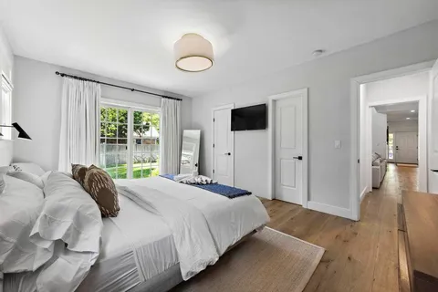 a view of entryway with wooden floor and stairs