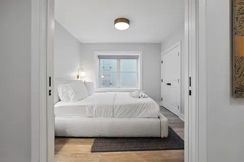 a view of a patio with couches chairs and a yard