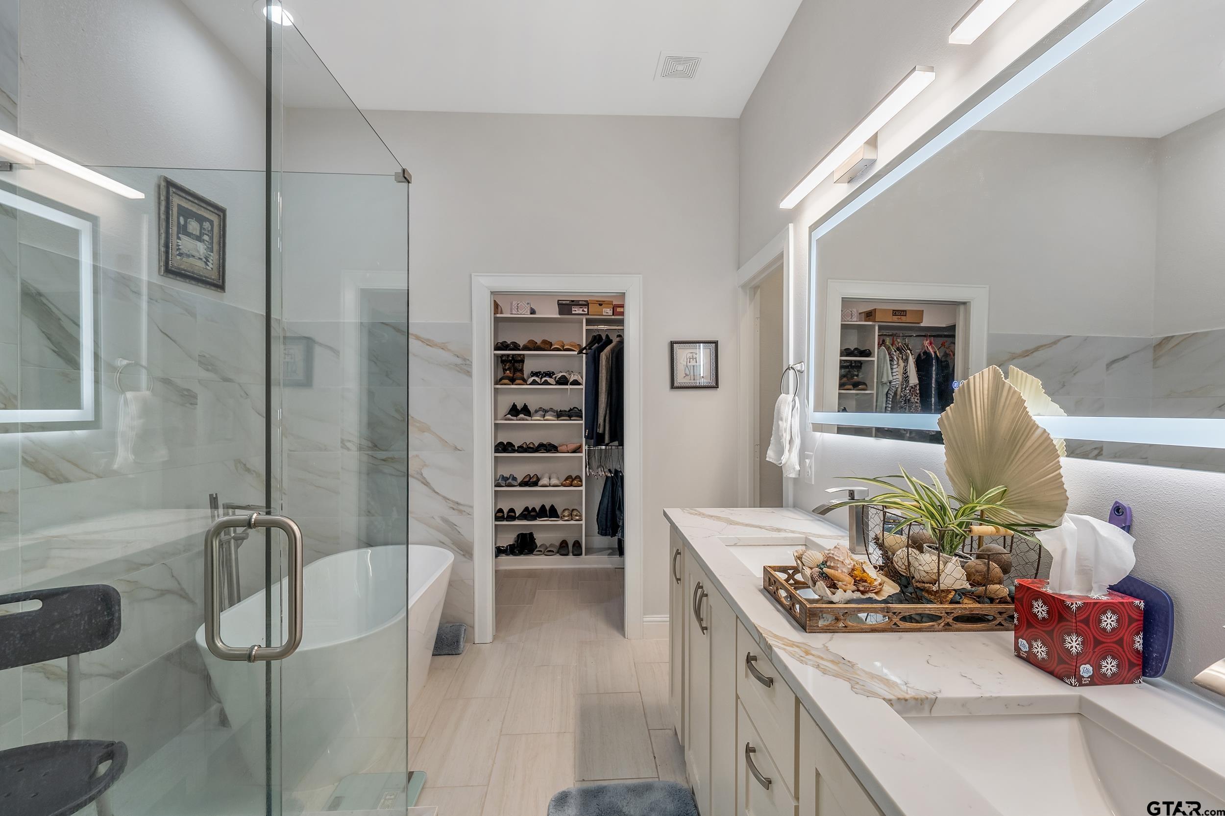 9109 Long Branch Tyler, TX 75703 - Photo 14 of 34 a kitchen with a sink stove and cabinets