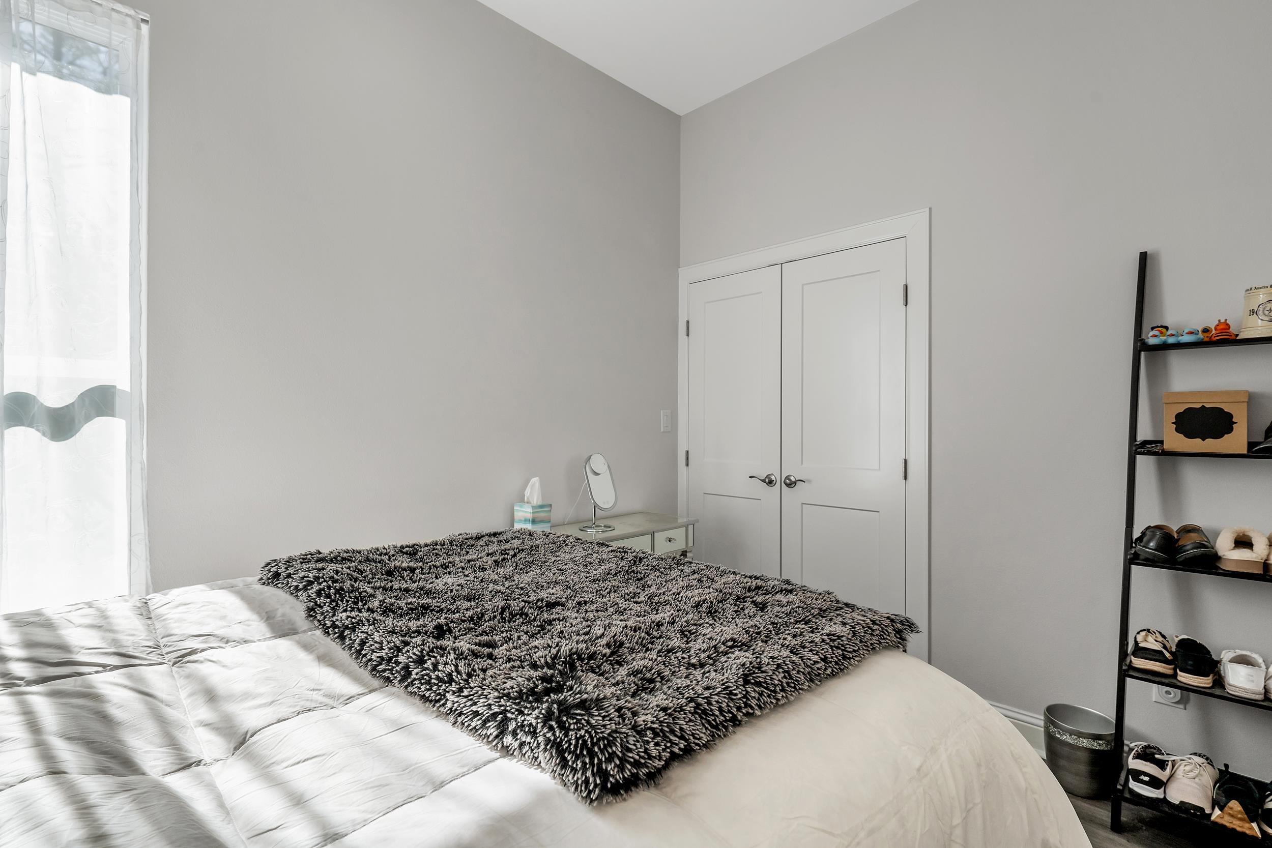 9109 Long Branch Tyler, TX 75703 - Photo 19 of 34 a bedroom with a bed and cabinets