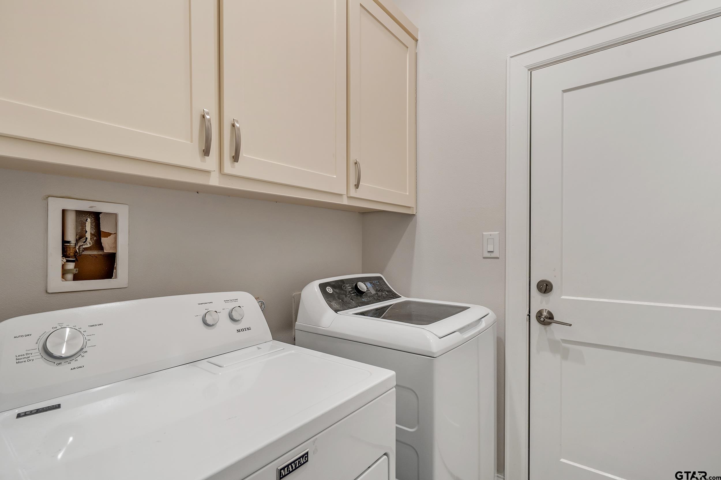 9109 Long Branch Tyler, TX 75703 - Photo 25 of 34 a utility room with dryer and washer