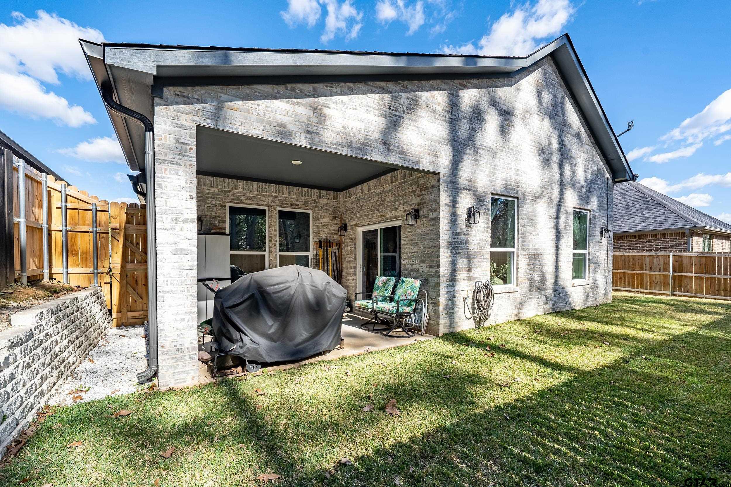 9109 Long Branch Tyler, TX 75703 - Photo 27 of 34 a view of a house with backyard and porch