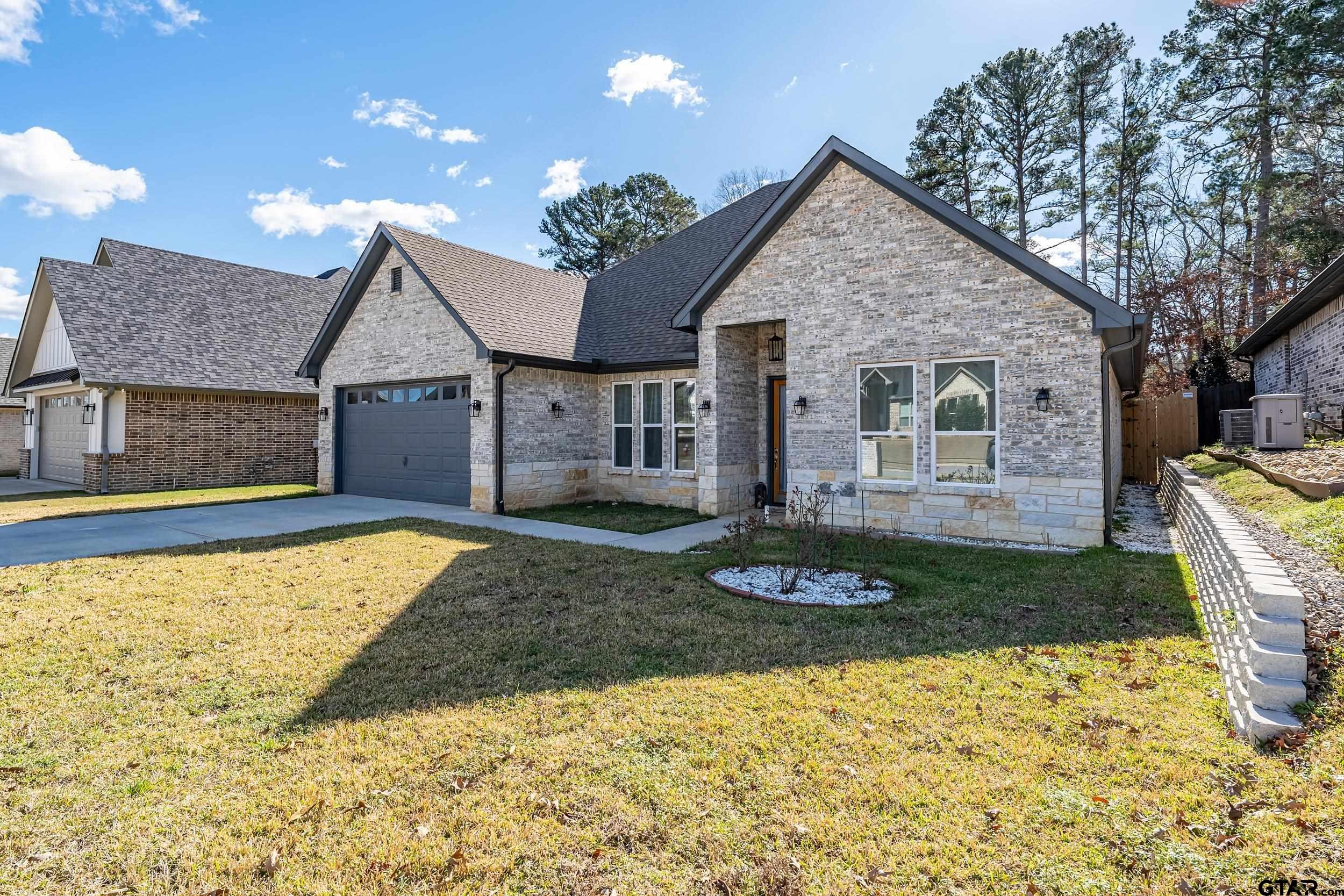 9109 Long Branch Tyler, TX 75703 - Photo 3 of 34 a view of a house with a yard and large tree