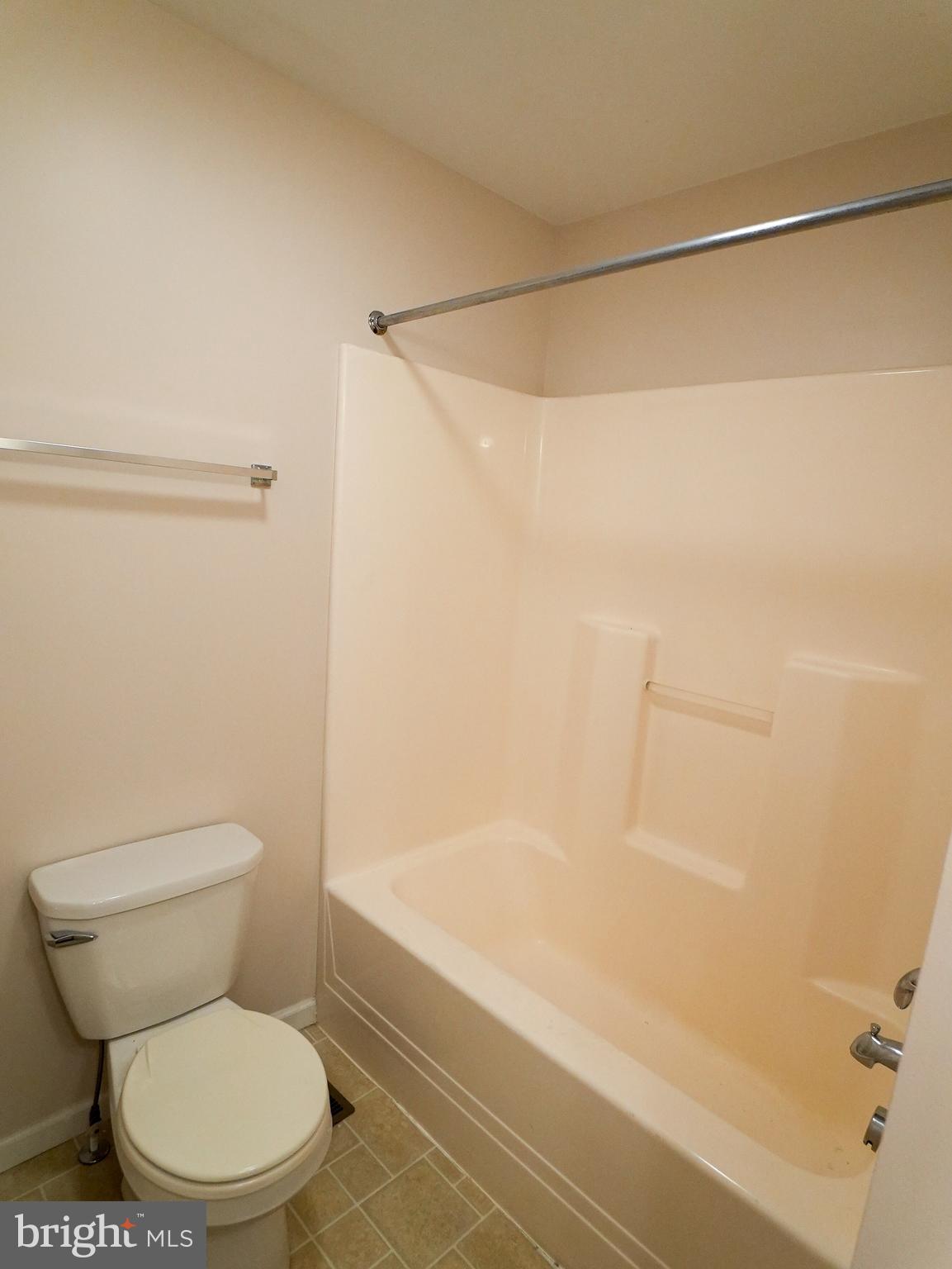 160 Mapleton Drive Harrisburg, PA 17112 - Photo 19 of 39 a white toilet sitting next to a bath tub and a shower