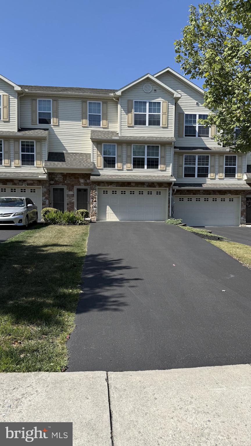 160 Mapleton Drive Harrisburg, PA 17112 - Photo 2 of 39 a front view of a house with a yard