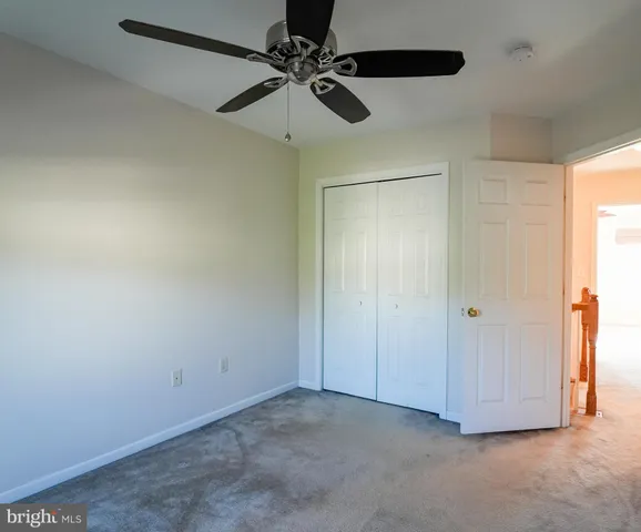 a kitchen with stainless steel appliances granite countertop a refrigerator a sink dishwasher a stove with wooden floors and cabinets