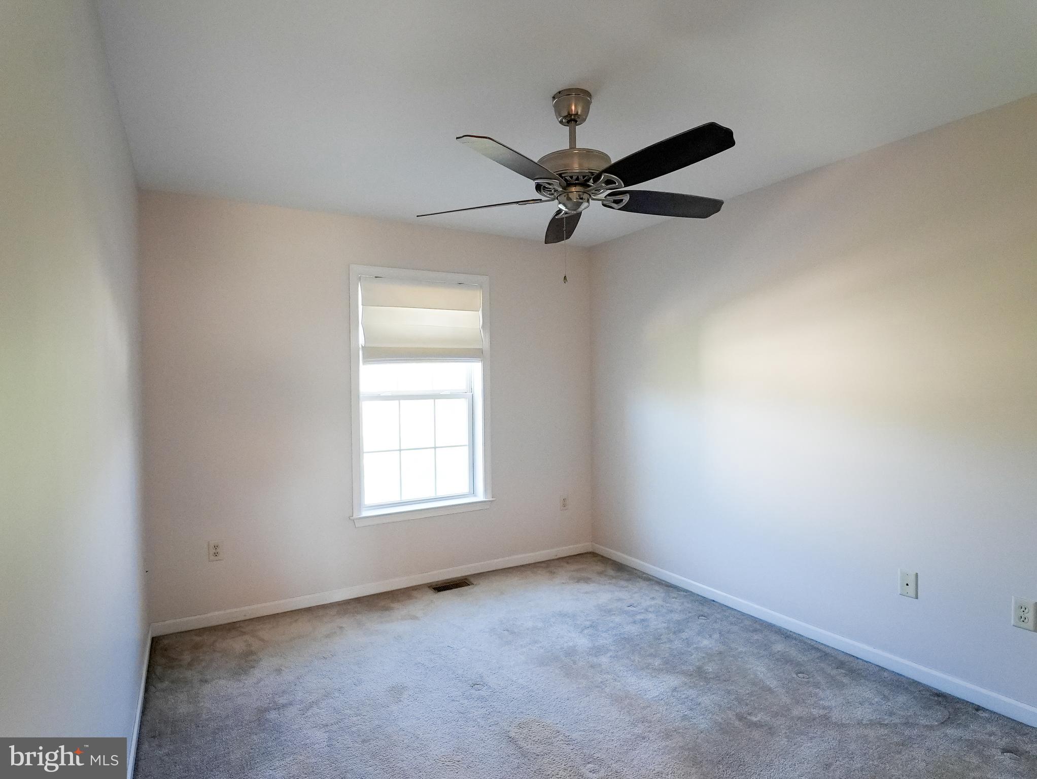 160 Mapleton Drive Harrisburg, PA 17112 - Photo 25 of 39 an empty room with a window and a fan