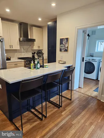 a kitchen with a sink appliances and cabinets