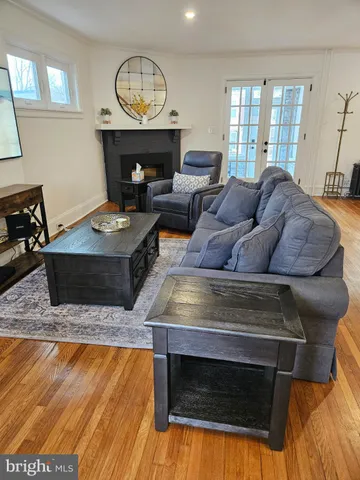 a bathroom with a granite countertop toilet a sink and a mirror
