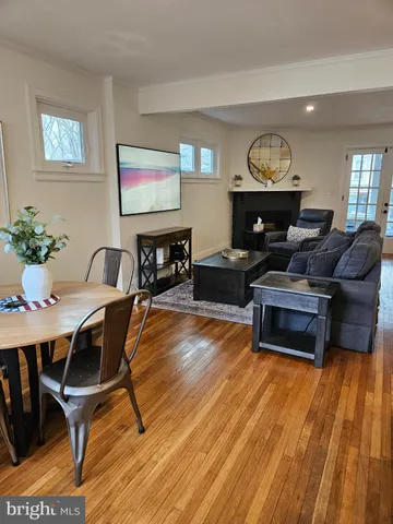 a bedroom with a bed and large mirror