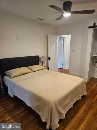 a bedroom with a bed and a fireplace