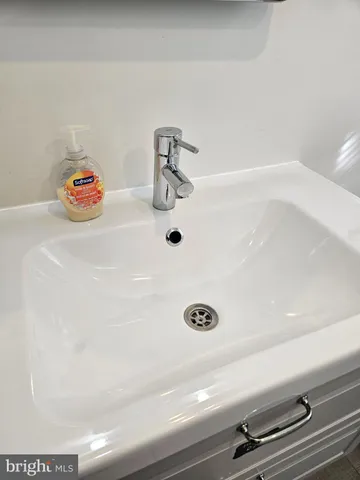 front view of a brick house with a small yard