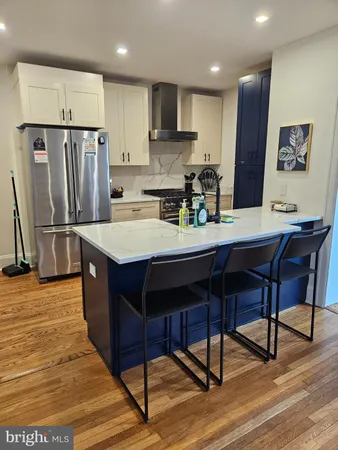 a kitchen with a table and chairs in it