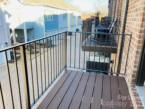 a view of balcony with wooden floor