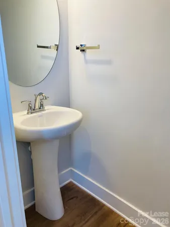 a bathroom with a sink and mirror