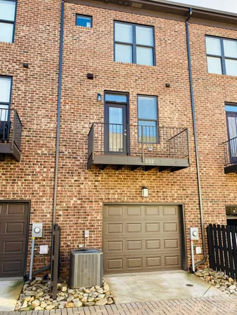 a front view of a building with a street