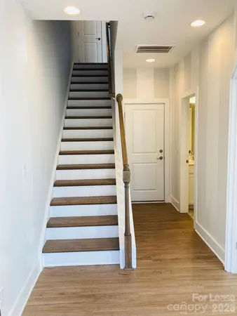 a view of an entryway with wooden floor