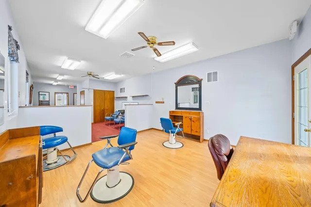 a room with furniture and kitchen view