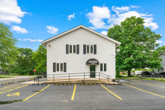 a view of a house with a yard and plants