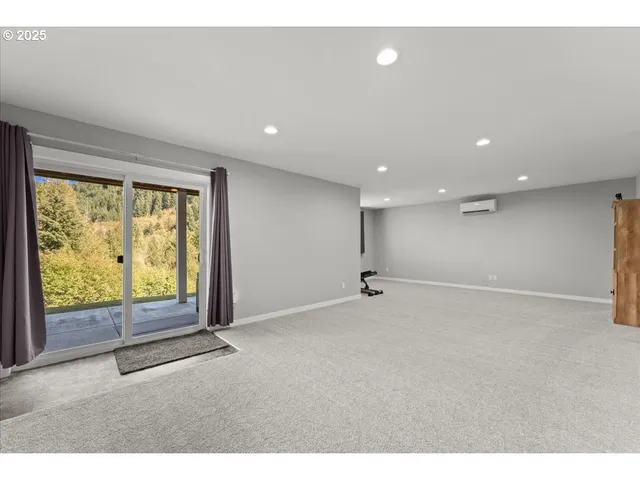 a bathroom with a granite countertop sink toilet a mirror and bathtub