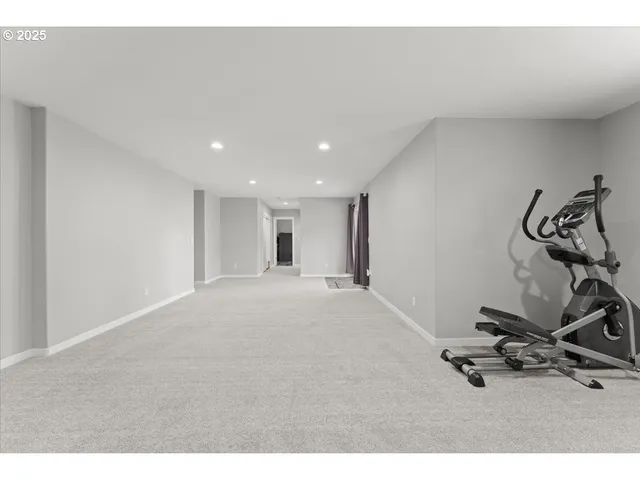 a bedroom with a bed and a desk