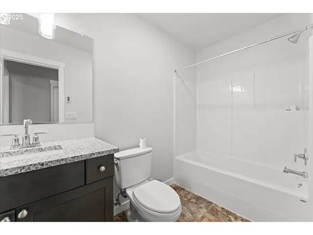 a view of a wooden house with a porch