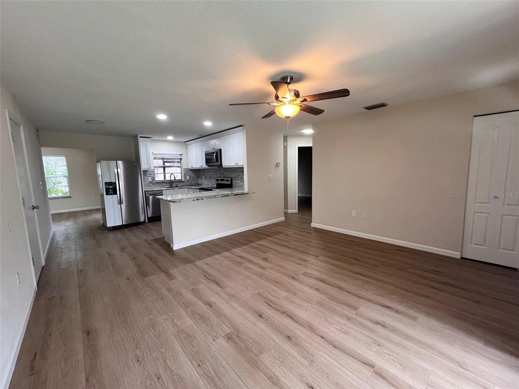 7020 Wentworth Way New Port Richey, FL 34655 - Photo 8 of 22 a view of a kitchen with a sink and a stove top oven