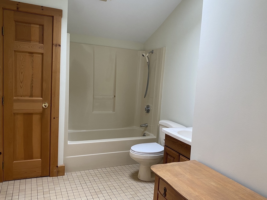 17 Jane Street Randolph, MA 02368 - Photo 11 of 18 a bathroom with a toilet a sink and bathtub