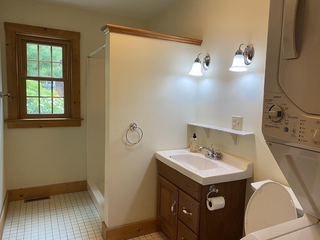 17 Jane Street Randolph, MA 02368 - Photo 12 of 18 a bathroom with a sink and mirror