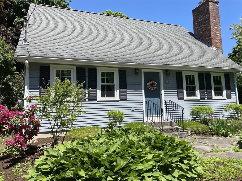 17 Jane Street Randolph, MA 02368 - Photo 17 of 18 a front view of a house with a garden