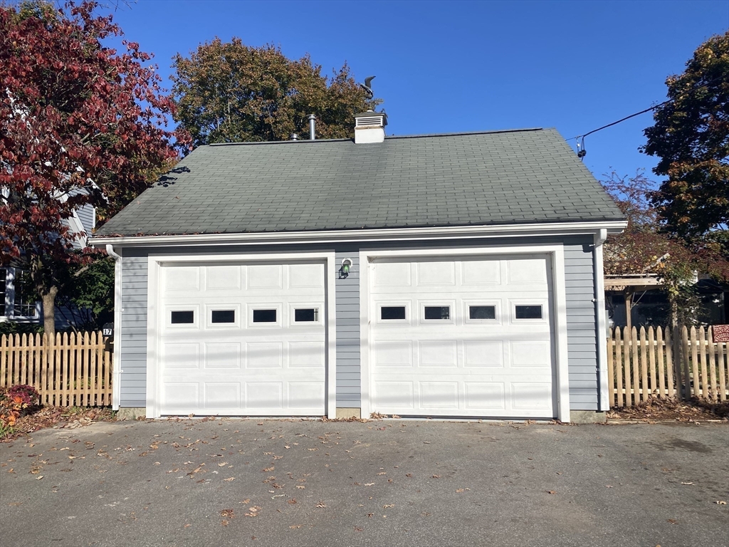 17 Jane Street Randolph, MA 02368 - Photo 18 of 18 a front view of a house with a garage